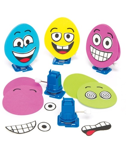 Speelsets met opwindbare eieren met grappige gezichten voor kinderen om te maken en te versieren. Creatieve paasknutselset voor kinderen (verpakking van 4)